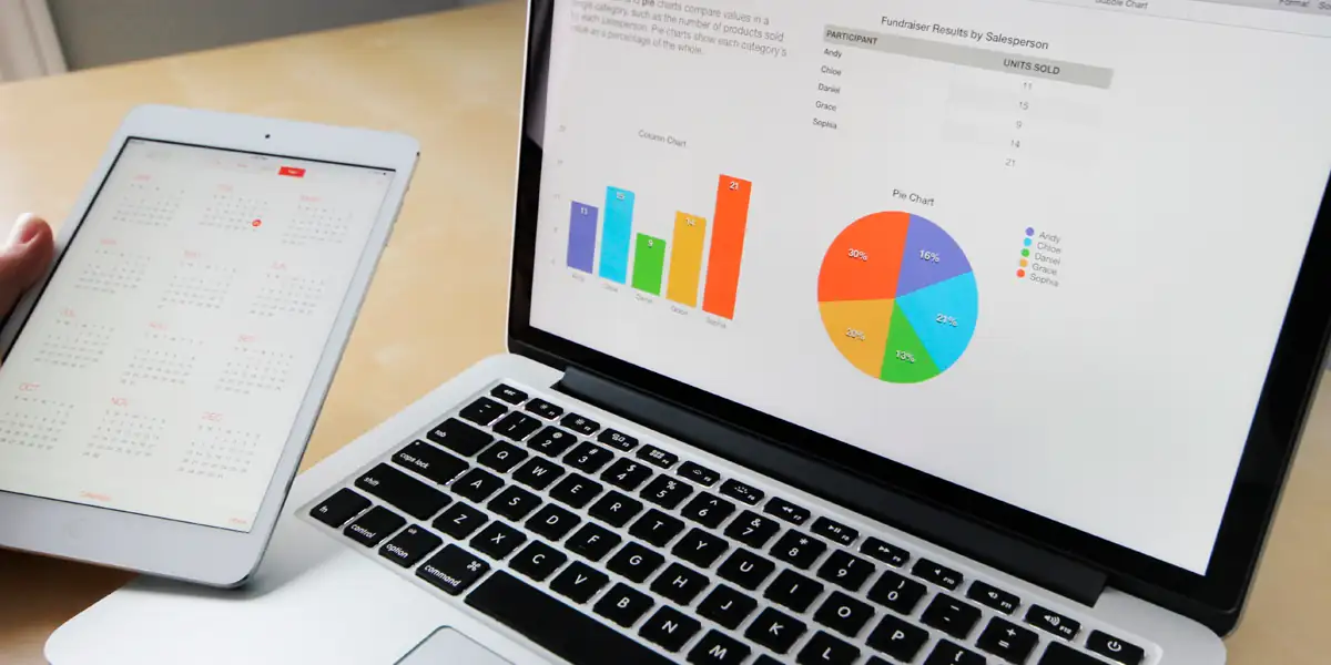 Customer Reviews in e-Commerce – laptop and tablet displaying sales analytics and performance charts