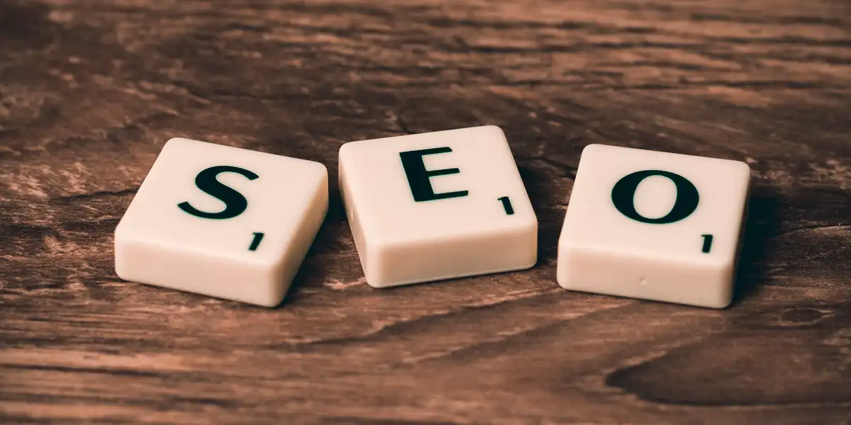 Search engines – SEO concept illustrated with letter tiles spelling SEO on a wooden surface