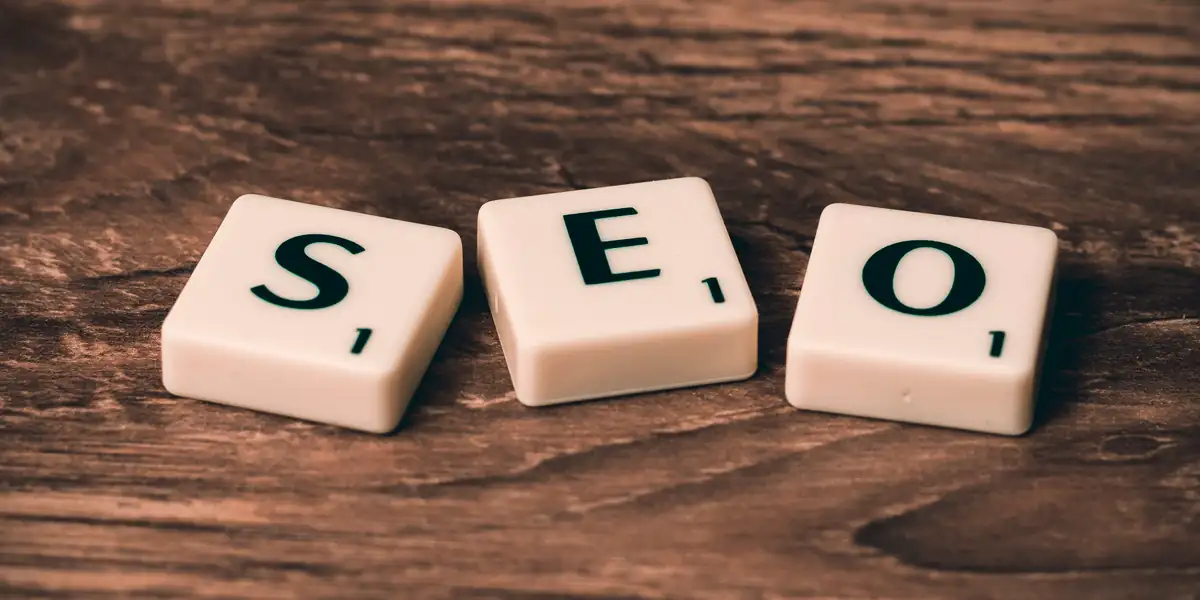 Squarespace SEO page, SEO letter tiles arranged on a wooden surface
