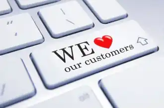 Reward your loyal customers. Keyboard key with the message “We love our customers,” representing how businesses reward their loyal customers.