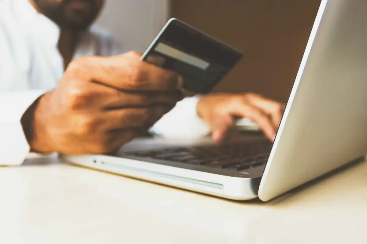 BigCommerce Reviews – customer making an online purchase on a laptop using a credit card