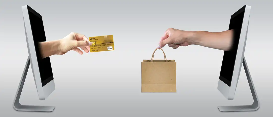 Cross selling – online purchase exchange with credit card and shopping bag on screens