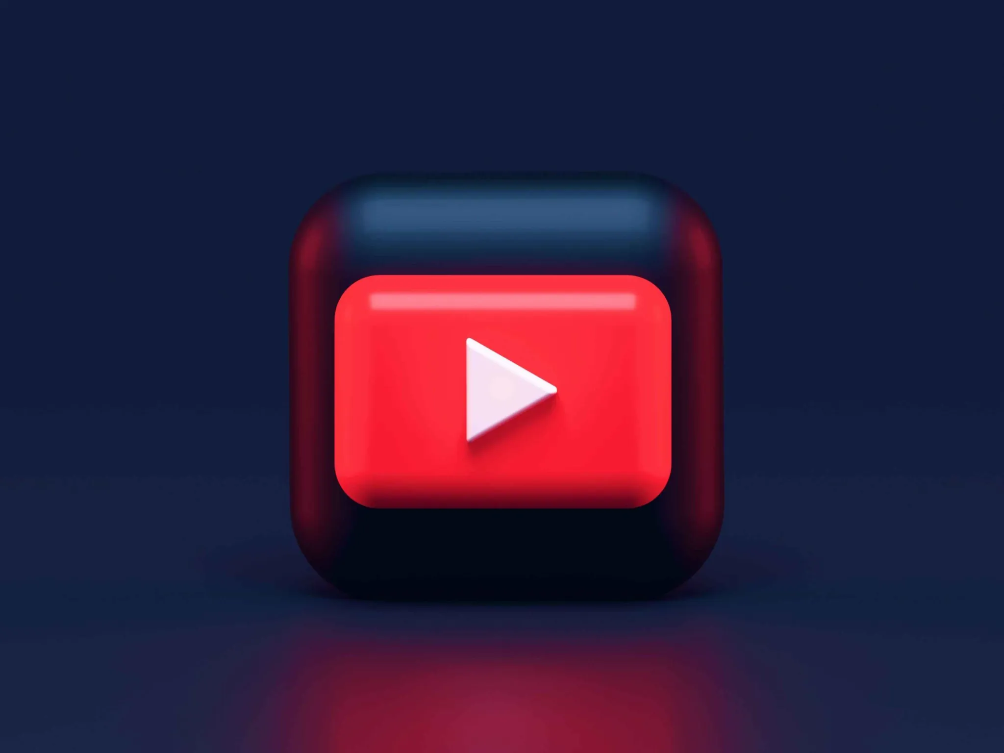 3D YouTube play button icon on a dark background representing youtube studio features and tools