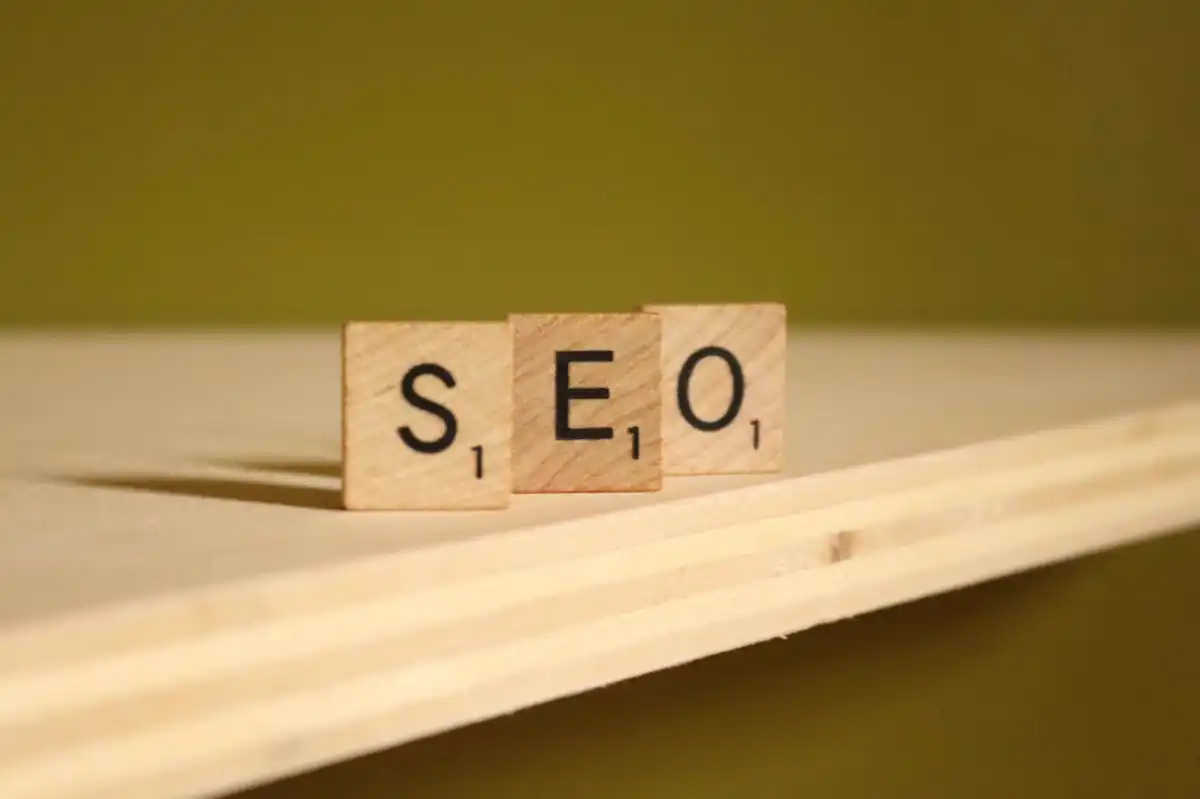 squarespace seo concept shown with wooden blocks spelling SEO on a shelf